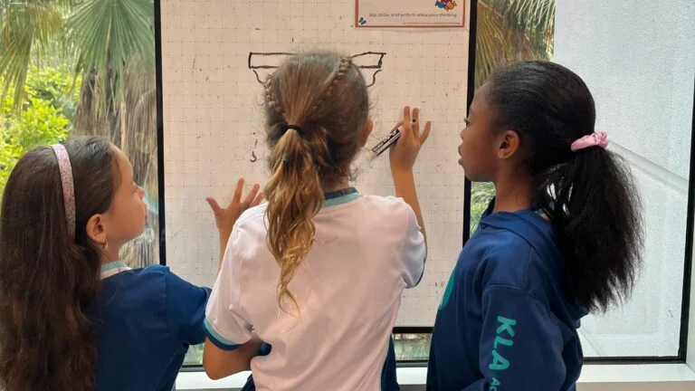 Children using a whiteboard