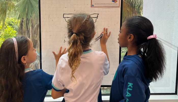 Children using a whiteboard