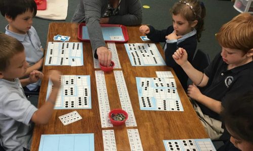 Woman teaching children